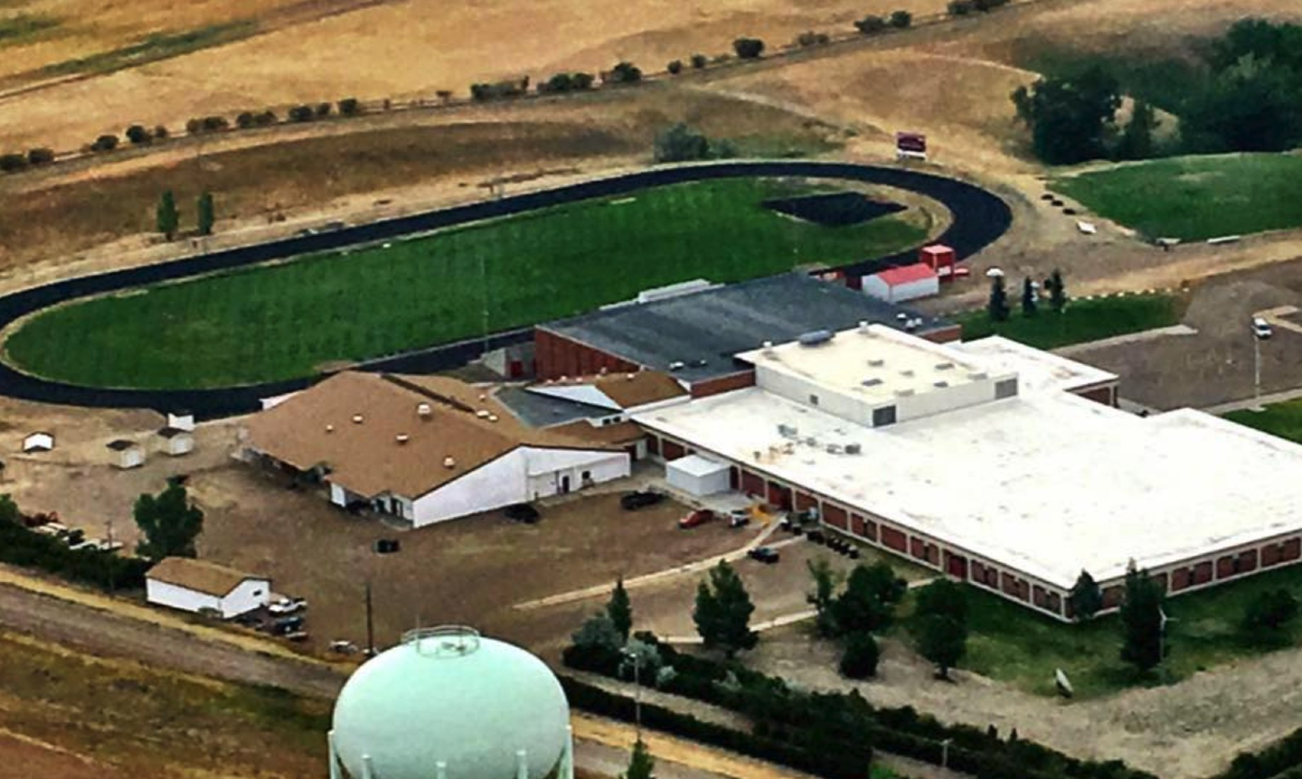 Aerial view of Glasgow High School and its football field, Glasgow, MT